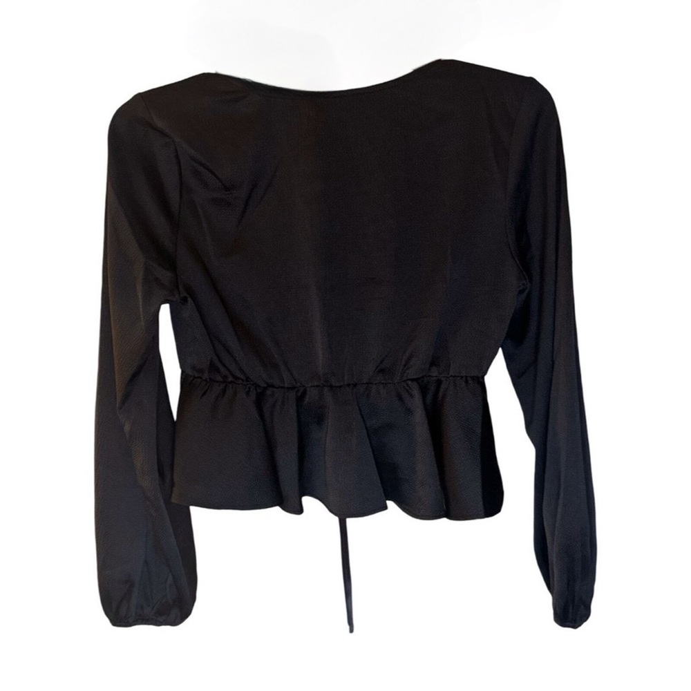 black "All in Favor Tie Front Satin Peplum Top" with a V-neck and long sleeves. - Picture 5 of 6